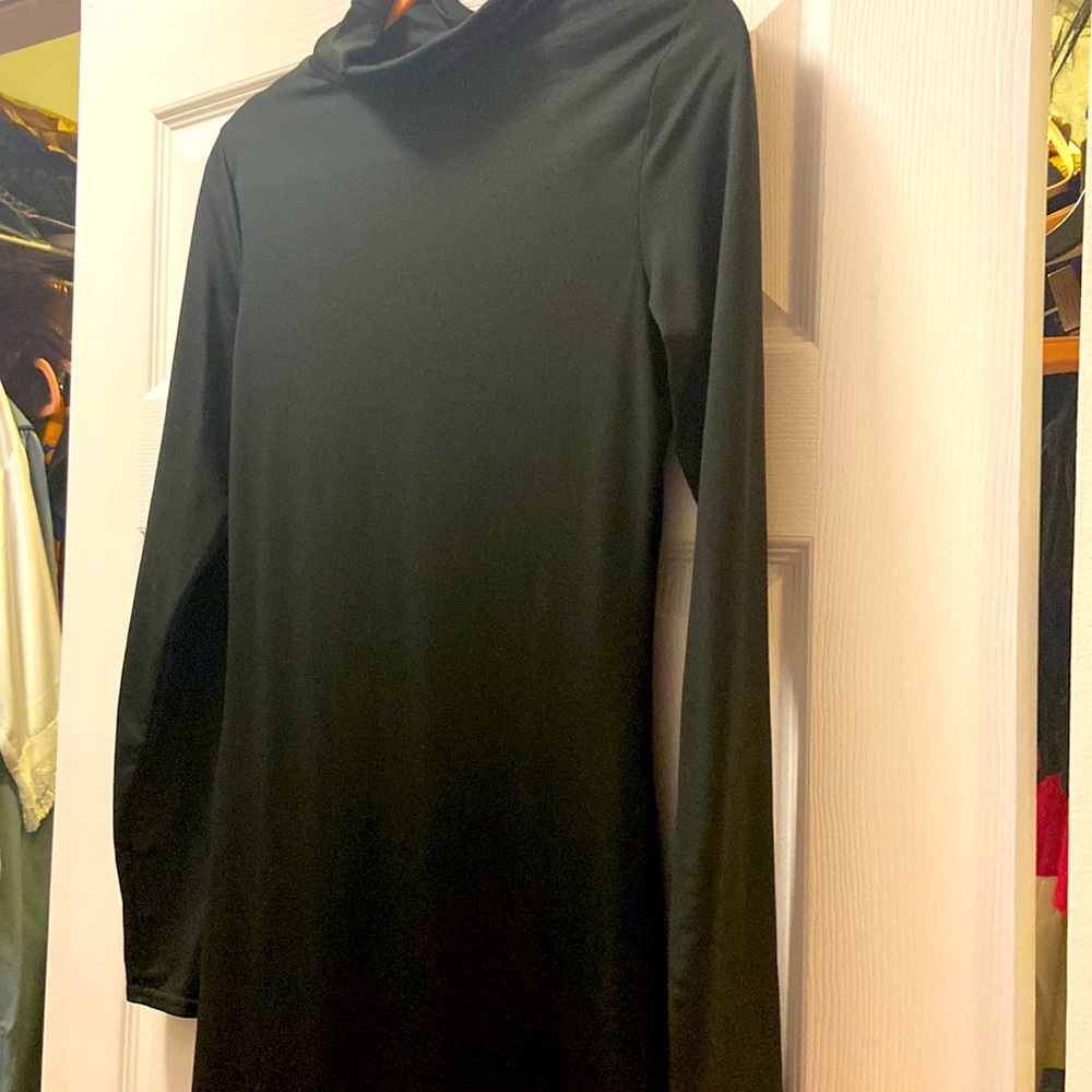 Black bodycon mid level dress.